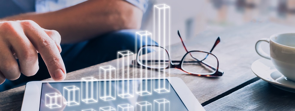 Businessman analyzing growing 3D AR chart above tablet computer screen